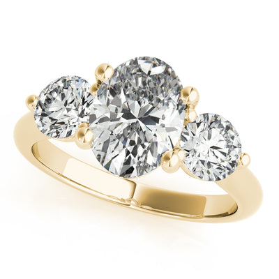A yellow gold engagement ring setting featuring an oval center diamond flanked by two round side diamonds in a classic four claw setting Brisbane