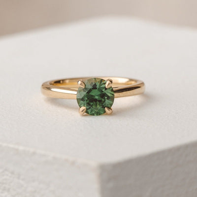 green round engagement ring