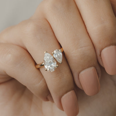 Gold ring with pear-shaped diamonds toi et moi ring on hand