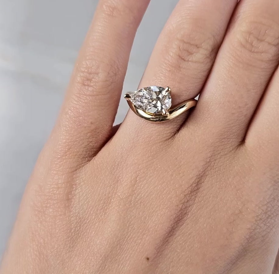 Pear Diamond Engagement Ring on curved band 