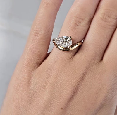 Pear Diamond Engagement Ring on curved band 
